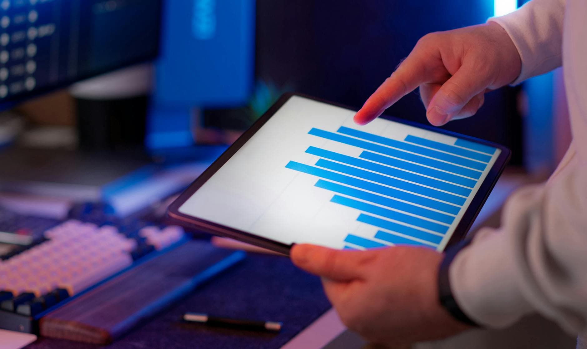 Business professional analyzing revenue data on tablet